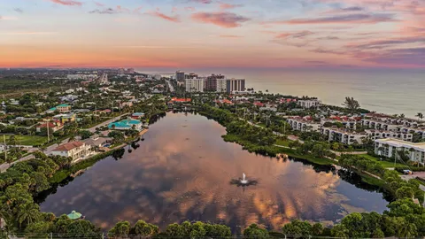 an aerial view of a houses with a yard