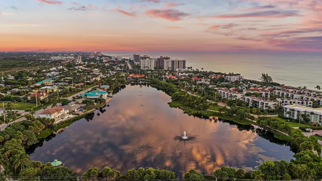 an aerial view of a houses with a yard