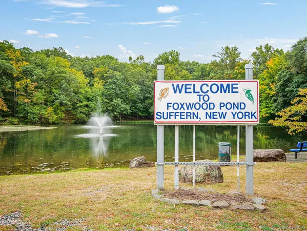 a view of a water fountain and a floor to ceiling window