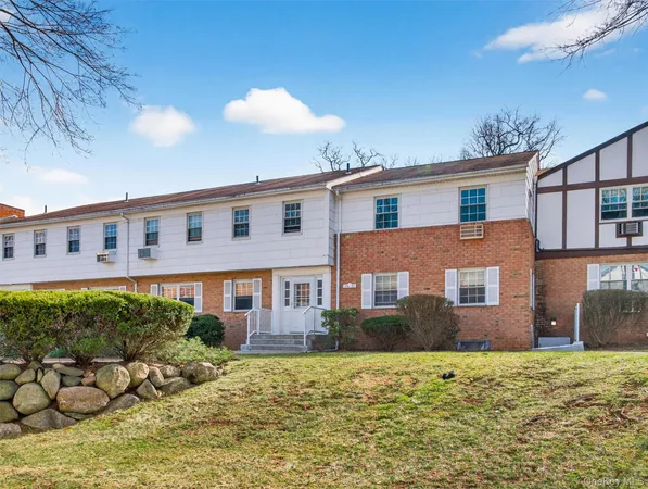 a view of a building with a yard