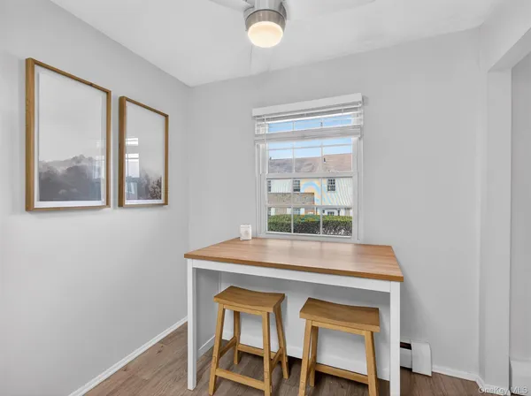 a dining room with a table and chairs