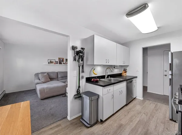 a kitchen with stainless steel appliances granite countertop a stove and a refrigerator