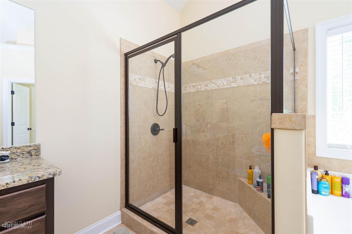 20 Laurel Ridge Forsyth, GA 31029 - Photo 11 of 34 a bathroom with a shower and a sink