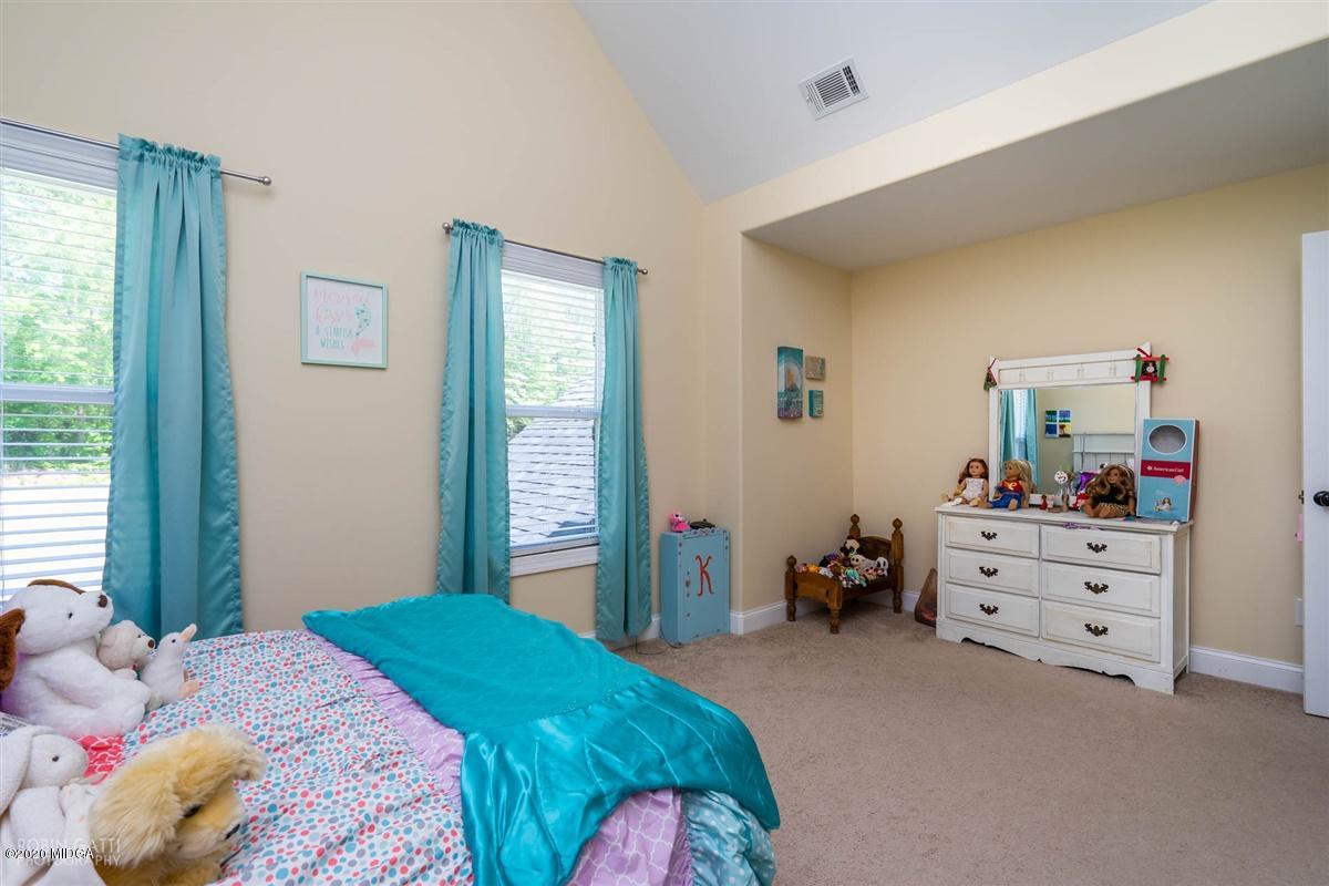 20 Laurel Ridge Forsyth, GA 31029 - Photo 21 of 34 a bedroom with a bed and a window