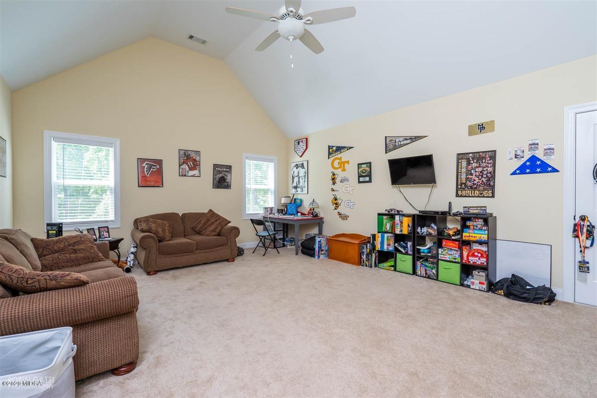 20 Laurel Ridge Forsyth, GA 31029 - Photo 23 of 34 a living room with furniture and a flat screen tv