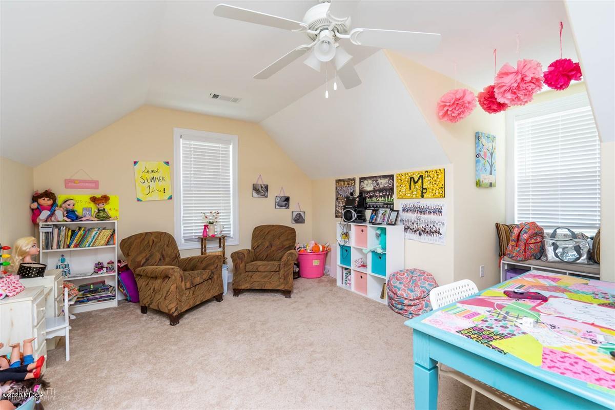 20 Laurel Ridge Forsyth, GA 31029 - Photo 25 of 34 a bedroom with furniture and a fan