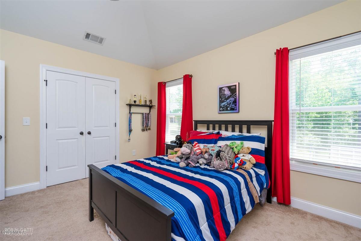20 Laurel Ridge Forsyth, GA 31029 - Photo 28 of 34 a bed room with a bed and a window