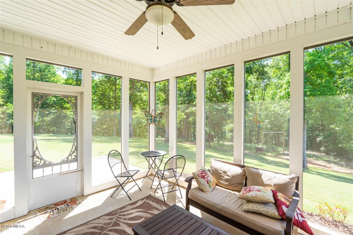 20 Laurel Ridge Forsyth, GA 31029 - Photo 31 of 34 a living room with furniture and floor to ceiling windows