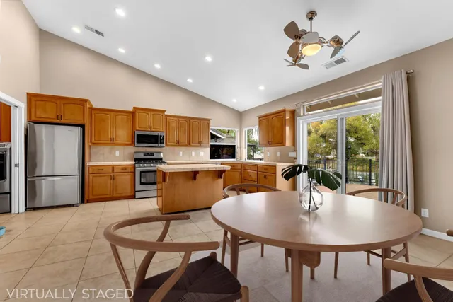 a kitchen with a stove top oven and refrigerator