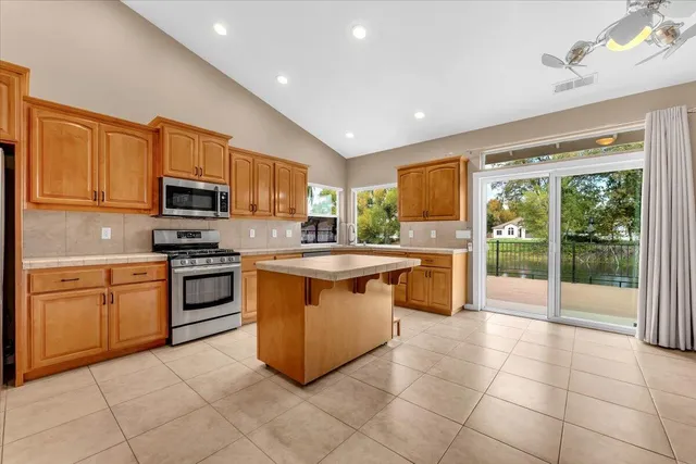 a kitchen with a stove a sink and a refrigerator