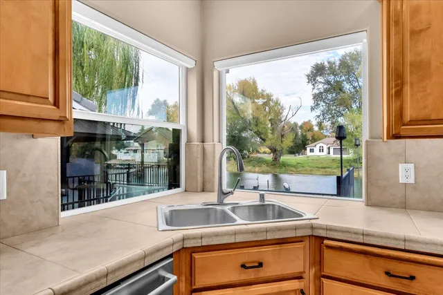 a living room with a bed furniture and a window