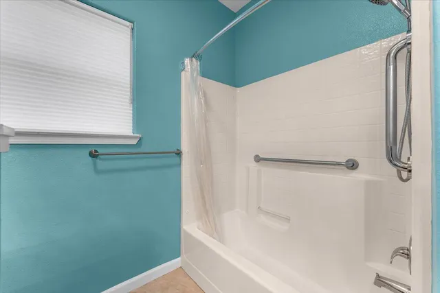 a front view of a house with a lake view