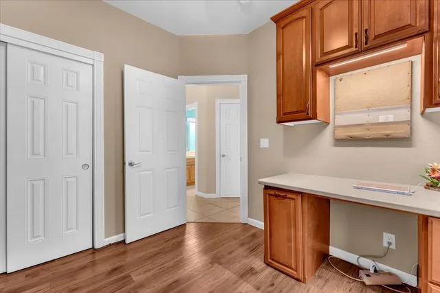 a view of a house with a yard and a fountain
