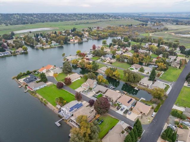a view of a dinning tables and chairs in patio of a house