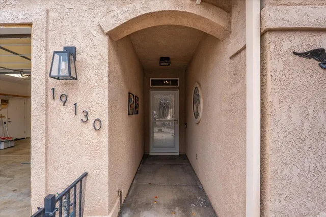 a front view of a house with utility room and wooden floor