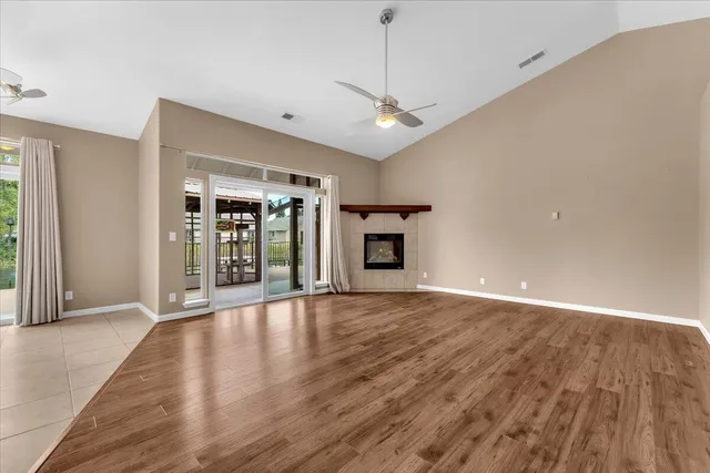 a view of a kitchen with a sink and a fireplace