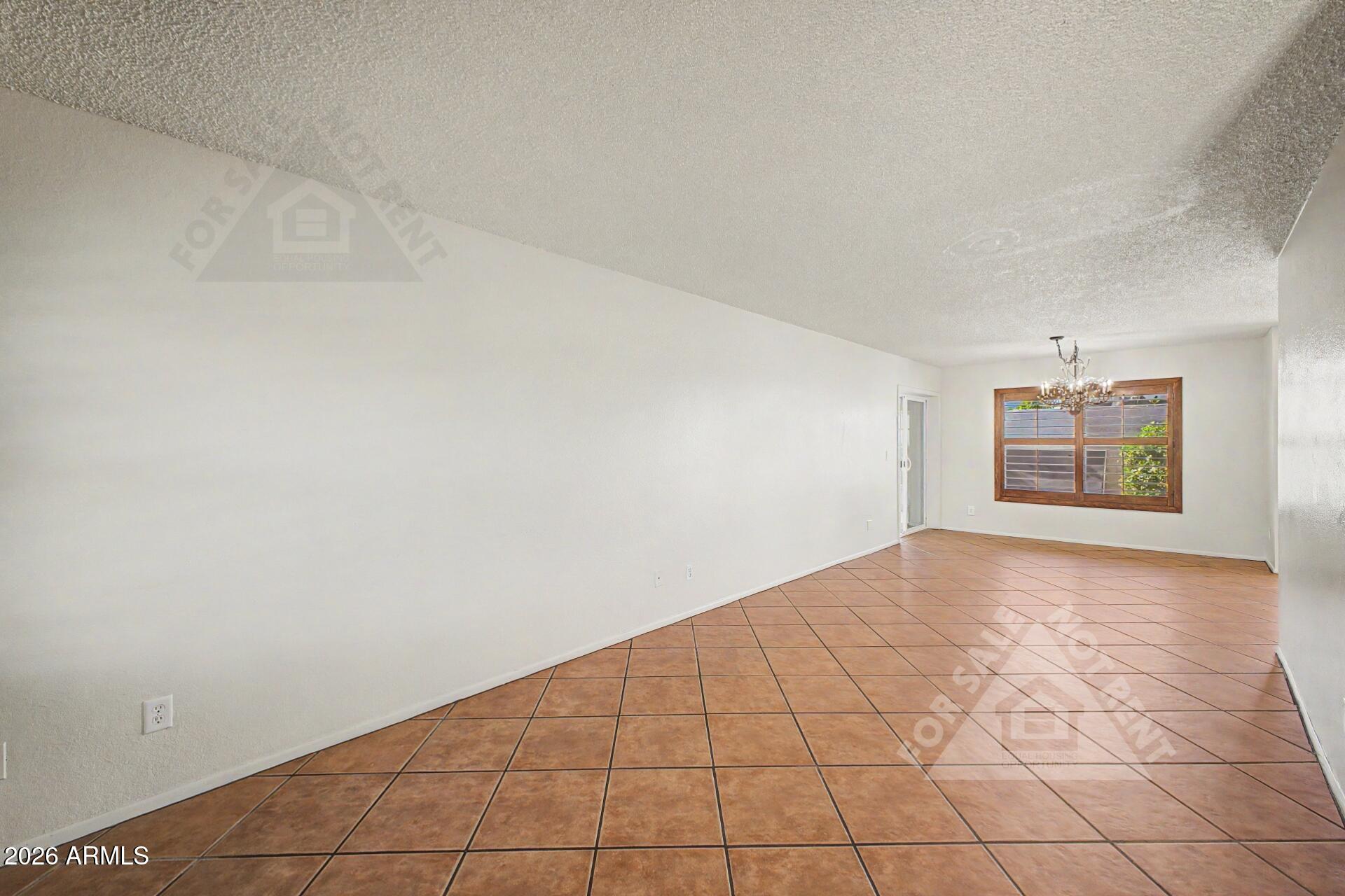912 East Villa Rita Drive Phoenix, AZ 85022 - Photo 11 of 27 an empty room with windows