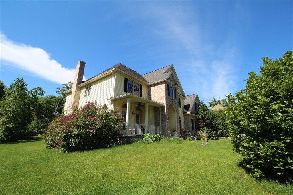 5 Gableview Lane Southwick, MA 01077 - Photo 7 of 41 a front view of a house with a yard