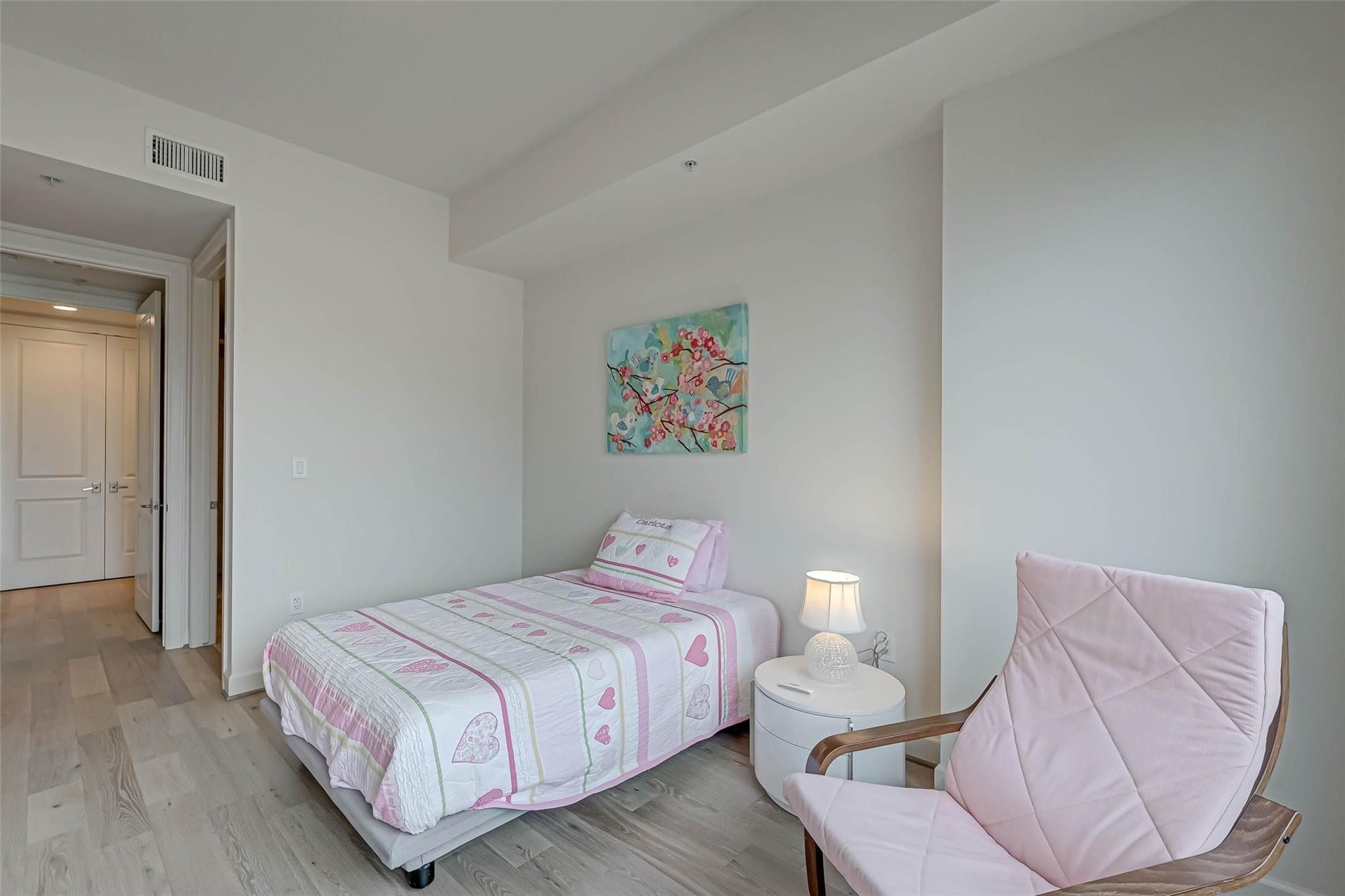 2207 Bancroft Lane, Unit 1202 Houston, TX 77027 - Photo 12 of 47 a bedroom with a bed and a couch