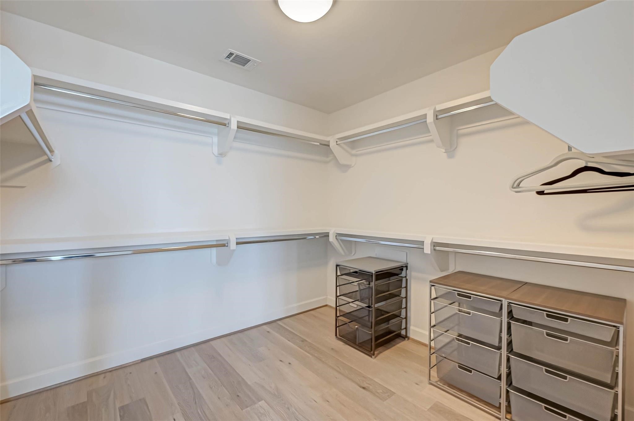 2207 Bancroft Lane, Unit 1202 Houston, TX 77027 - Photo 15 of 47 a view of walk in closet with empty racks