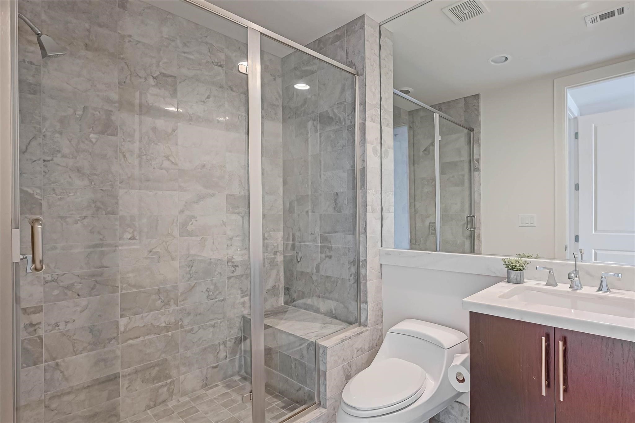 2207 Bancroft Lane, Unit 1202 Houston, TX 77027 - Photo 19 of 47 a bathroom with a sink toilet and shower