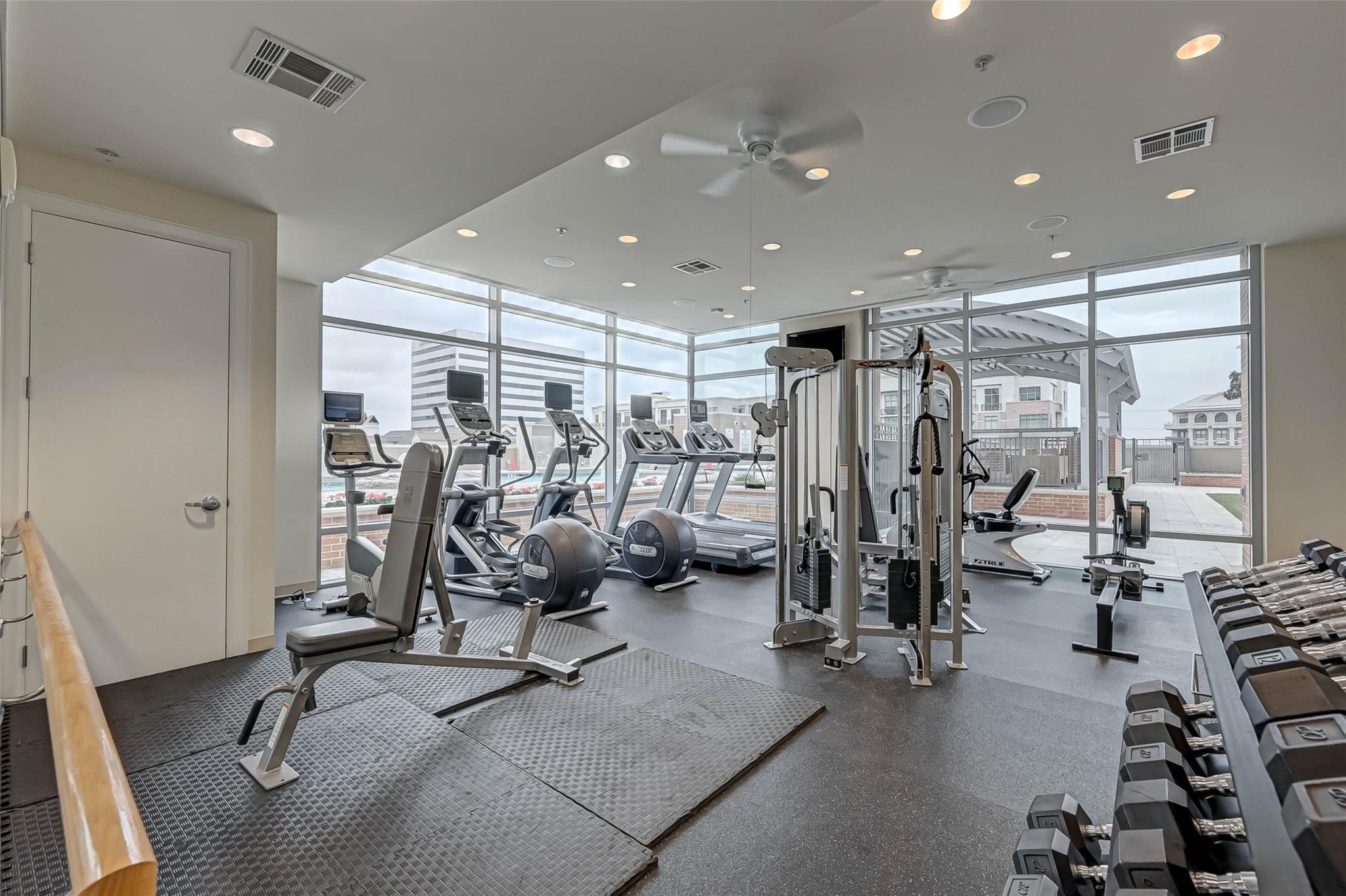 2207 Bancroft Lane, Unit 1202 Houston, TX 77027 - Photo 22 of 47 a view of a room with gym equipment