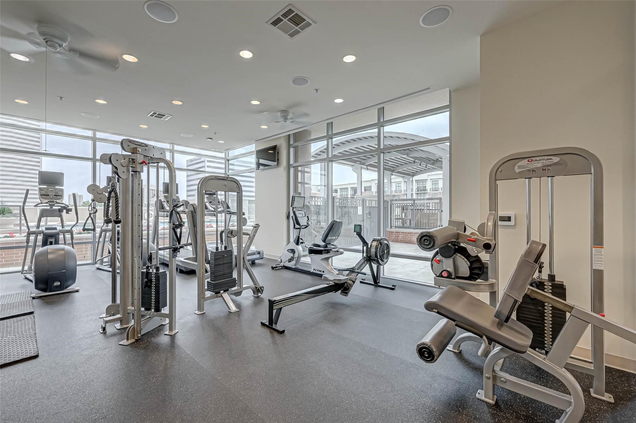 2207 Bancroft Lane, Unit 1202 Houston, TX 77027 - Photo 23 of 47 a view of a room with gym equipment
