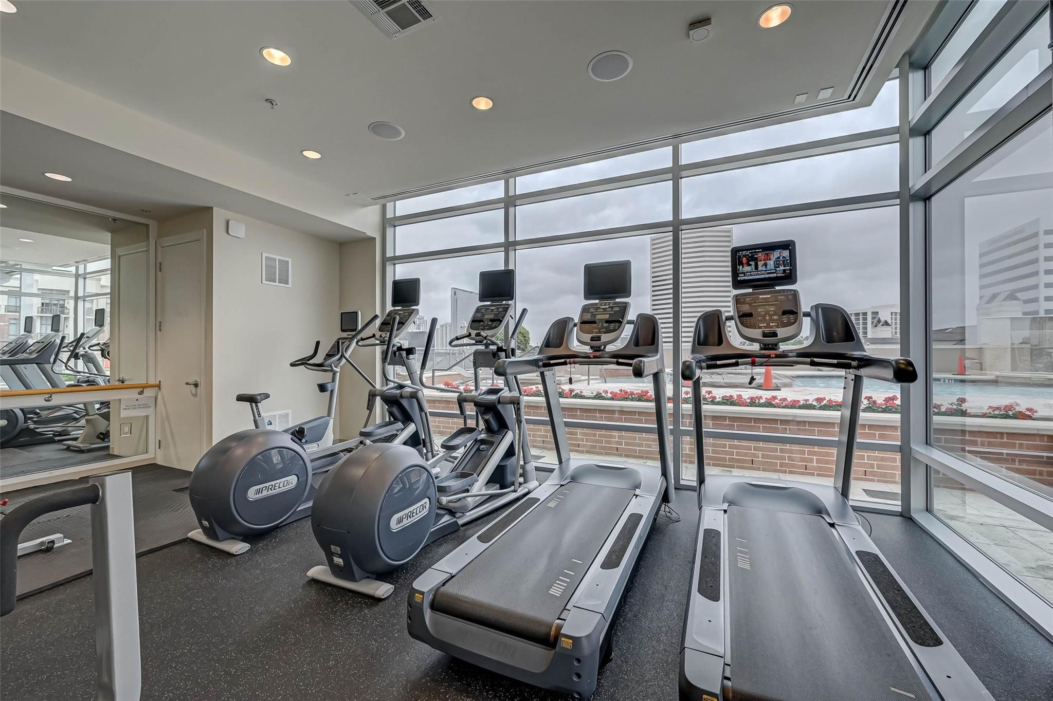 2207 Bancroft Lane, Unit 1202 Houston, TX 77027 - Photo 24 of 47 a view of a room with gym equipment