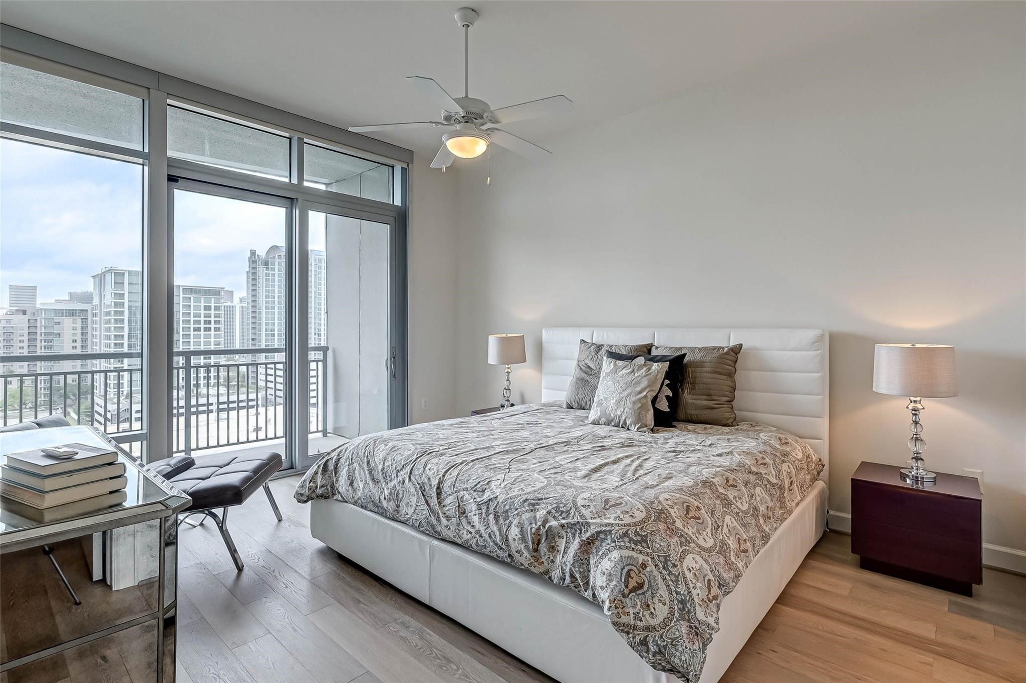 2207 Bancroft Lane, Unit 1202 Houston, TX 77027 - Photo 3 of 47 a bedroom with a bed and a large window