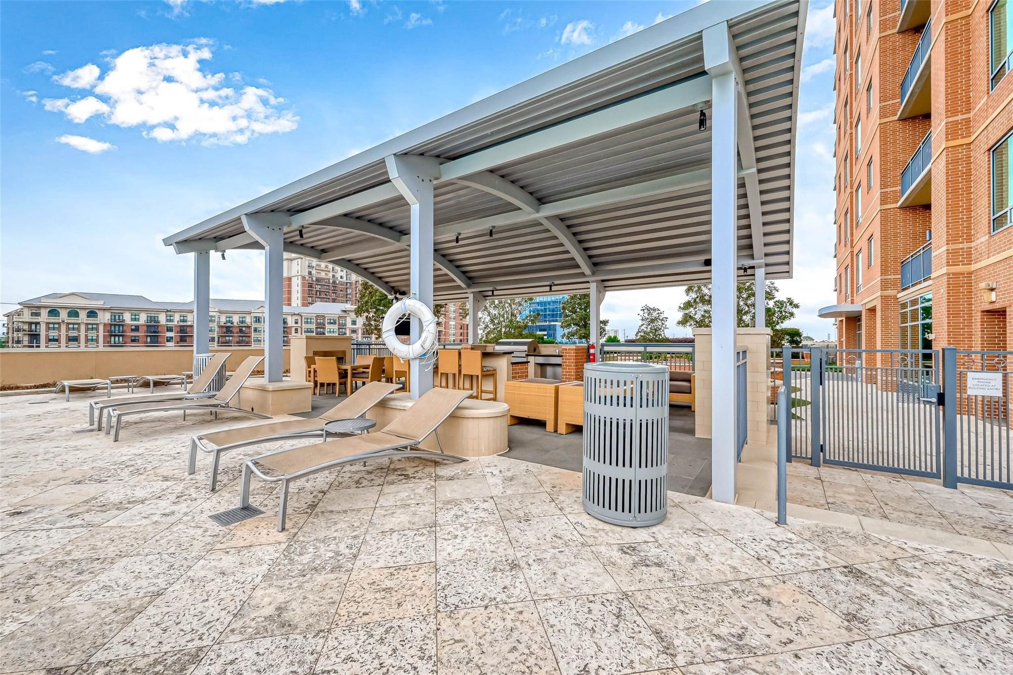 2207 Bancroft Lane, Unit 1202 Houston, TX 77027 - Photo 32 of 47 a view of a swimming pool with a patio