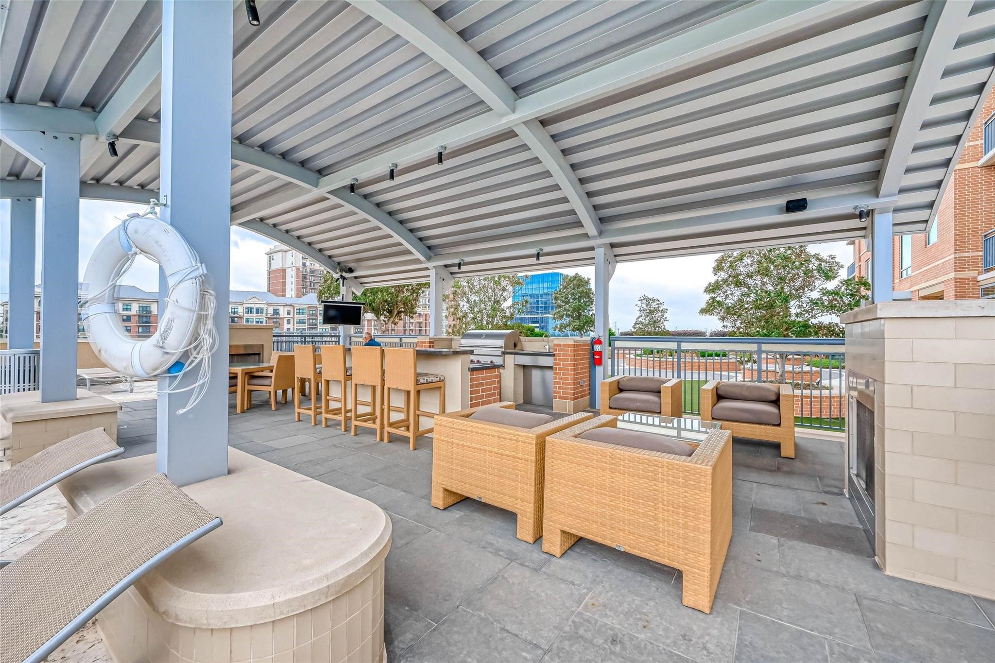 2207 Bancroft Lane, Unit 1202 Houston, TX 77027 - Photo 33 of 47 a living room with furniture and large windows