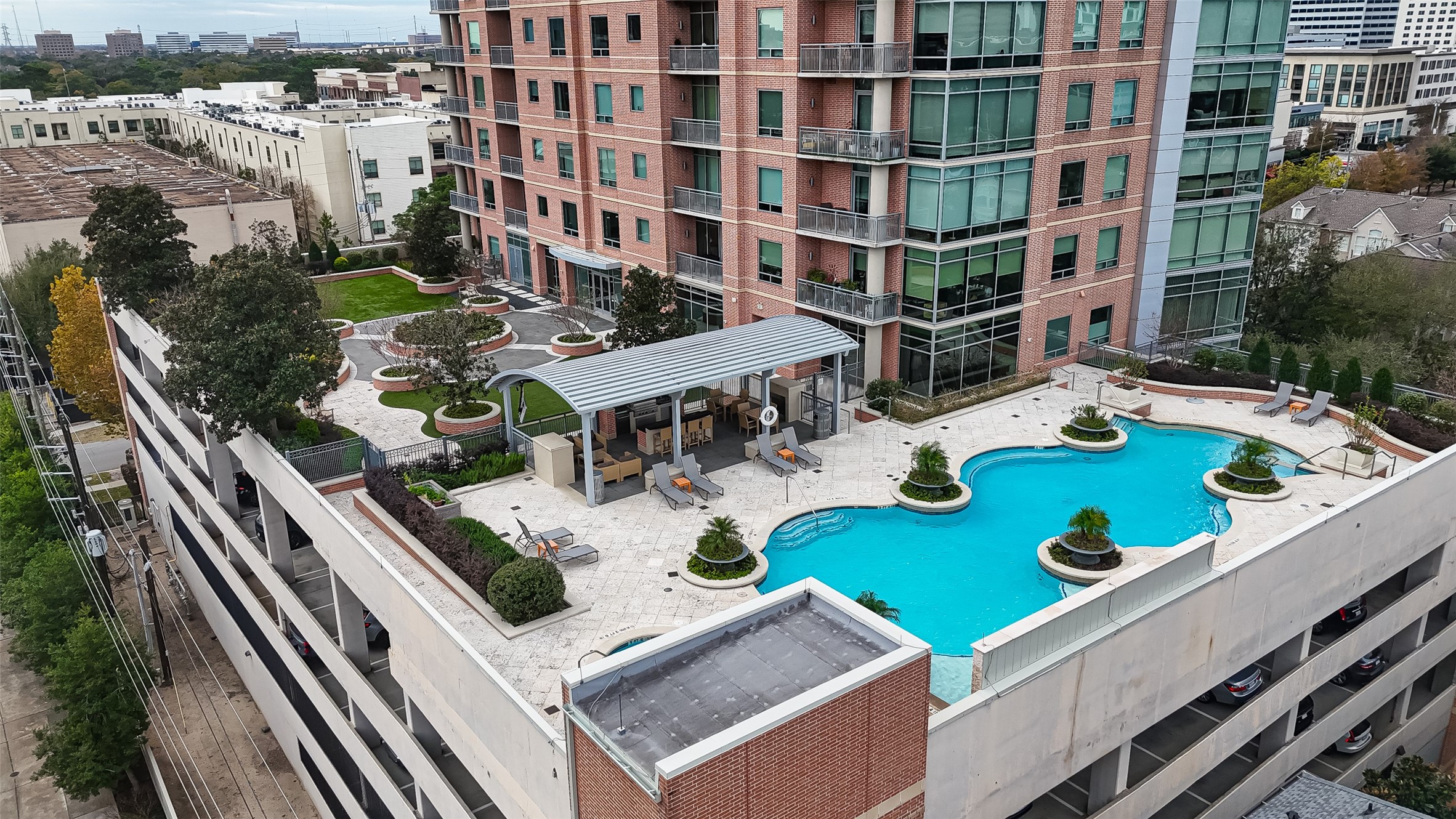 2207 Bancroft Lane, Unit 1202 Houston, TX 77027 - Photo 38 of 47 a view of a swimming pool with outdoor seating