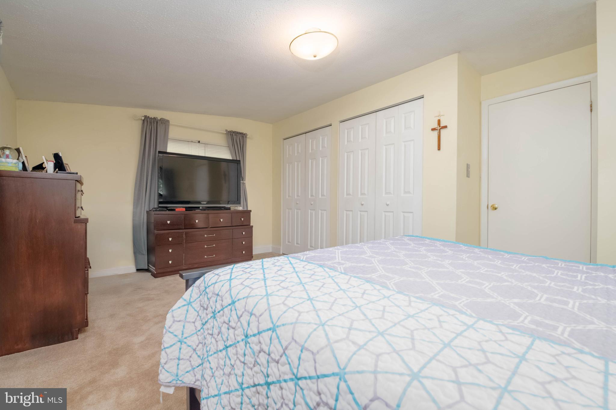 1006 Lourdes Road Baltimore, MD 21221 - Photo 17 of 43 a bedroom with a bed and a television