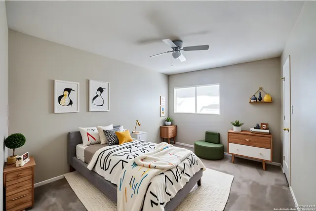 a bedroom with a bed and ceiling fan