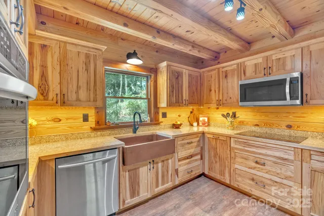 a kitchen with a sink stove and microwave