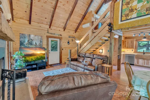 a living room with furniture and a flat screen tv
