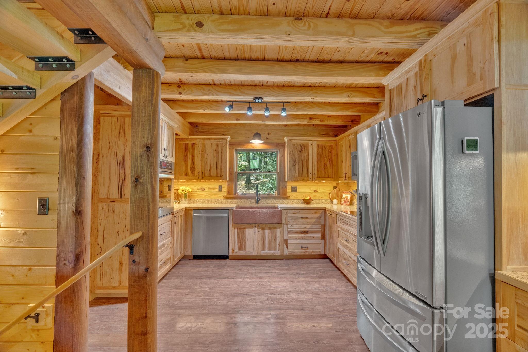 103 Mountain Laurel Road Pisgah Forest, NC 28768 - Photo 10 of 40 a large kitchen with a window