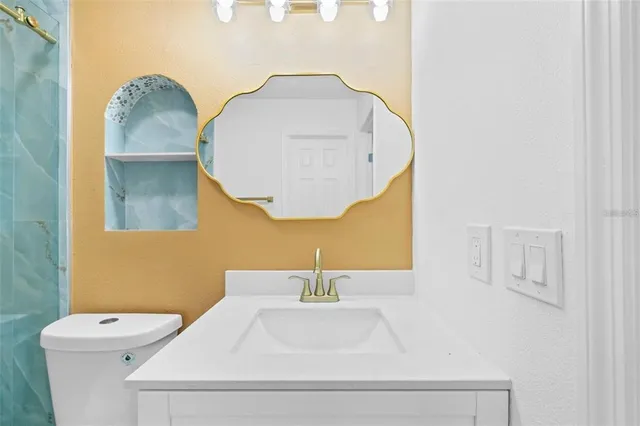 a bathroom with a sink and a mirror