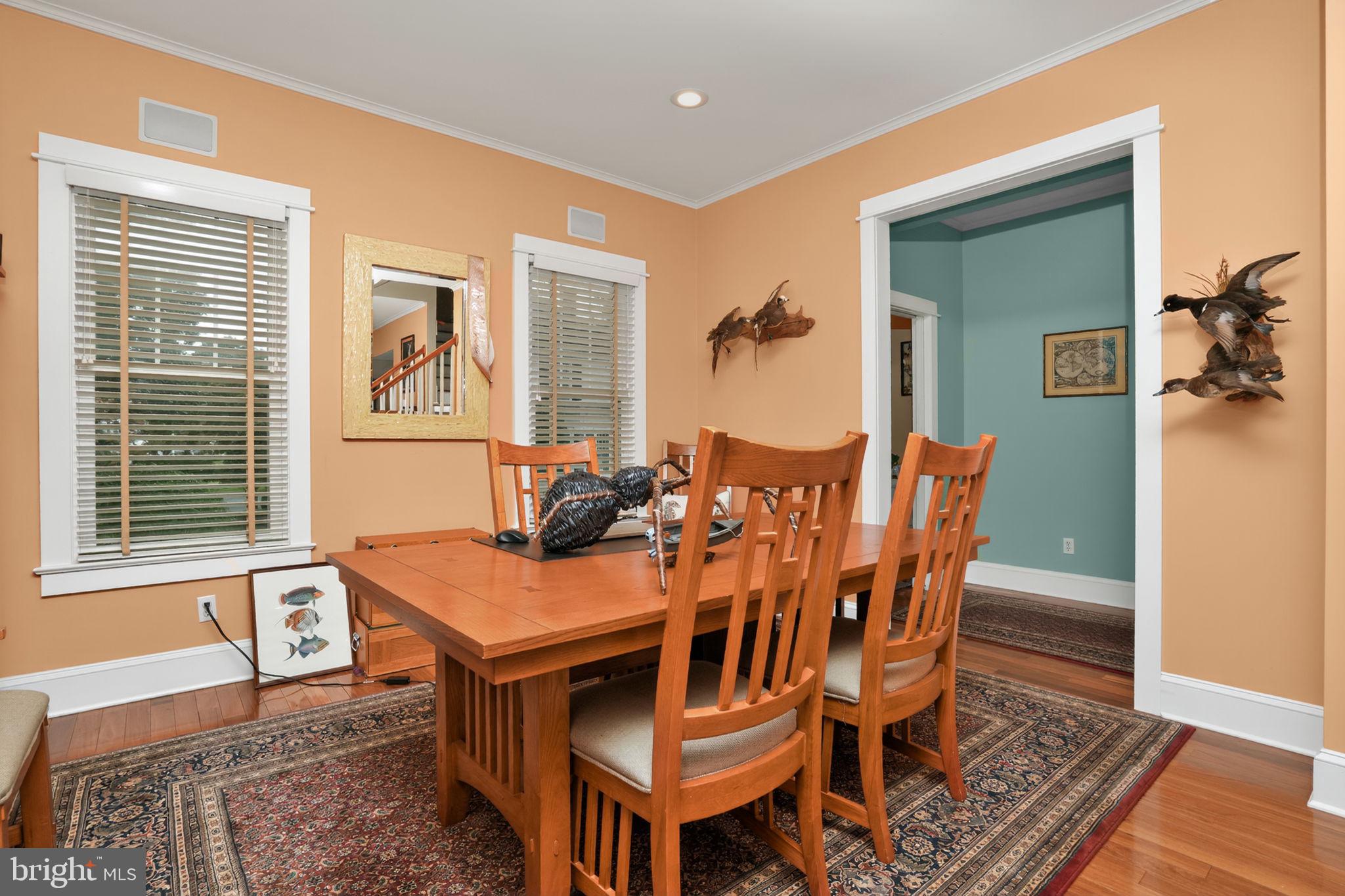 501 South Main Street Berlin, MD 21811 - Photo 13 of 75 a view of a dining room with furniture and wooden floor
