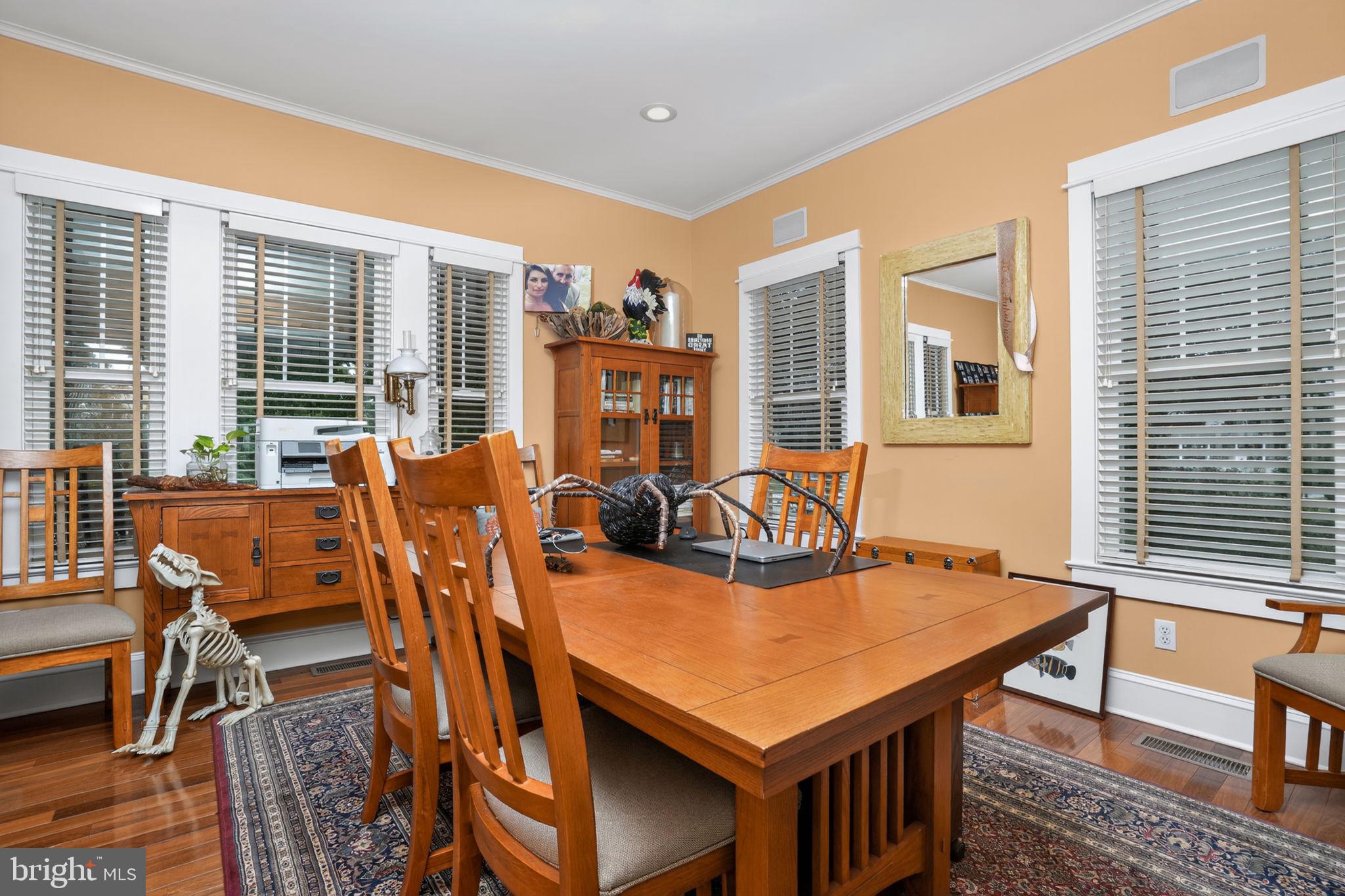 501 South Main Street Berlin, MD 21811 - Photo 14 of 75 a view of a dining room with furniture window and wooden floor
