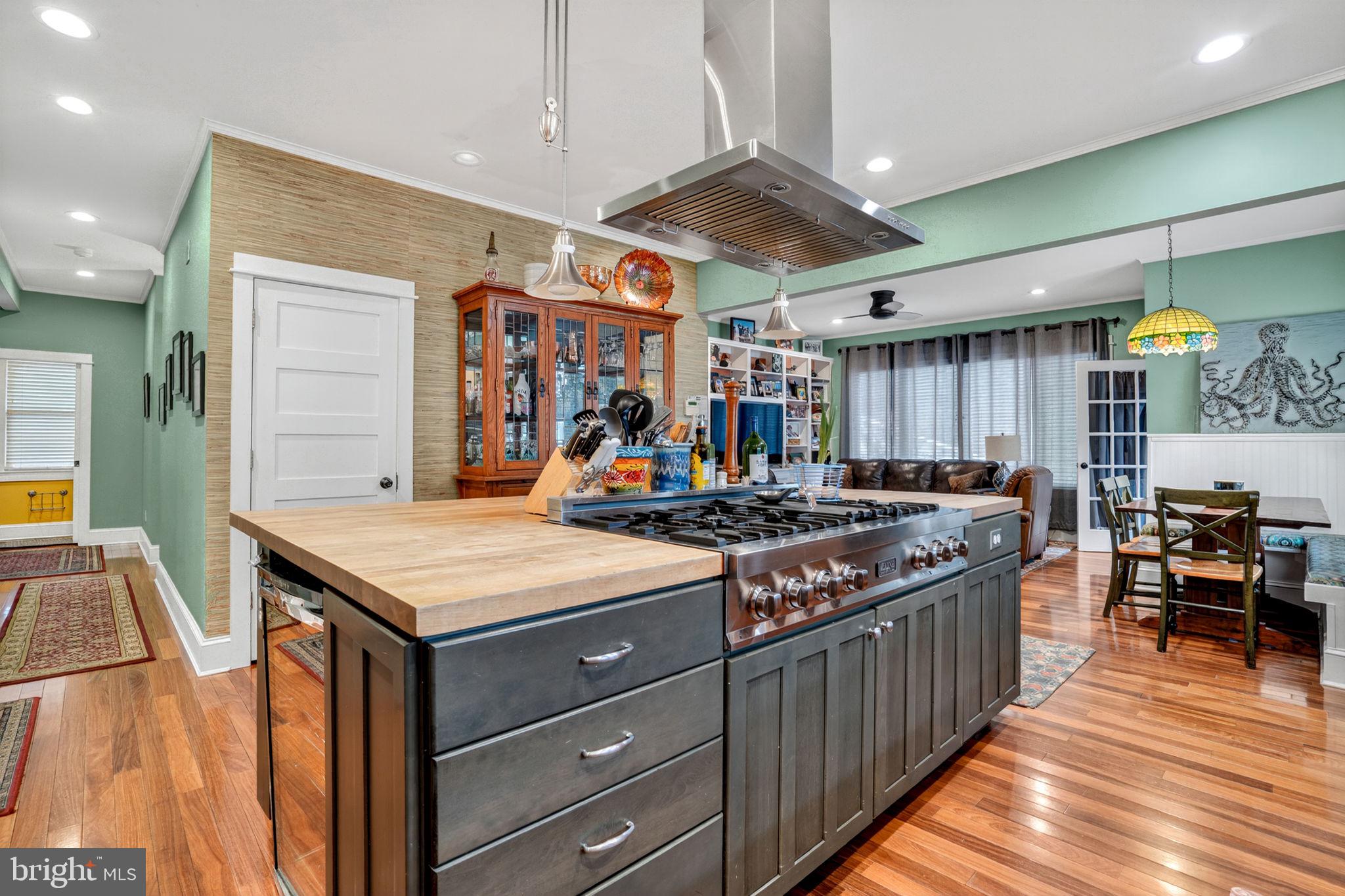 501 South Main Street Berlin, MD 21811 - Photo 19 of 75 a kitchen with stainless steel appliances granite countertop a stove and a refrigerator