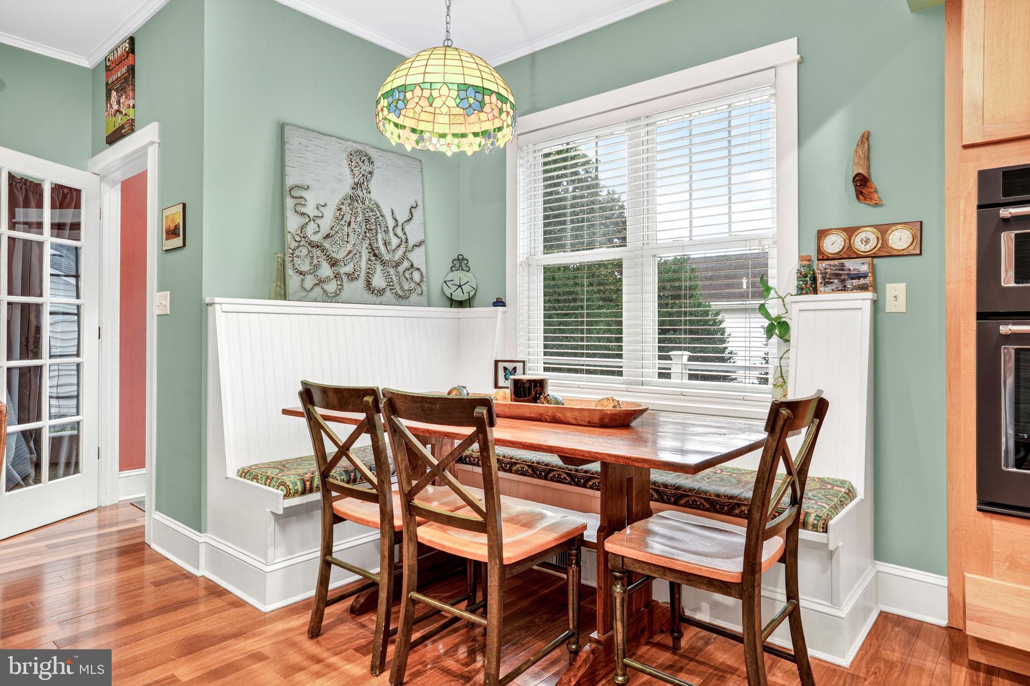 501 South Main Street Berlin, MD 21811 - Photo 22 of 75 a view of a dining room with furniture wooden floor and chandelier