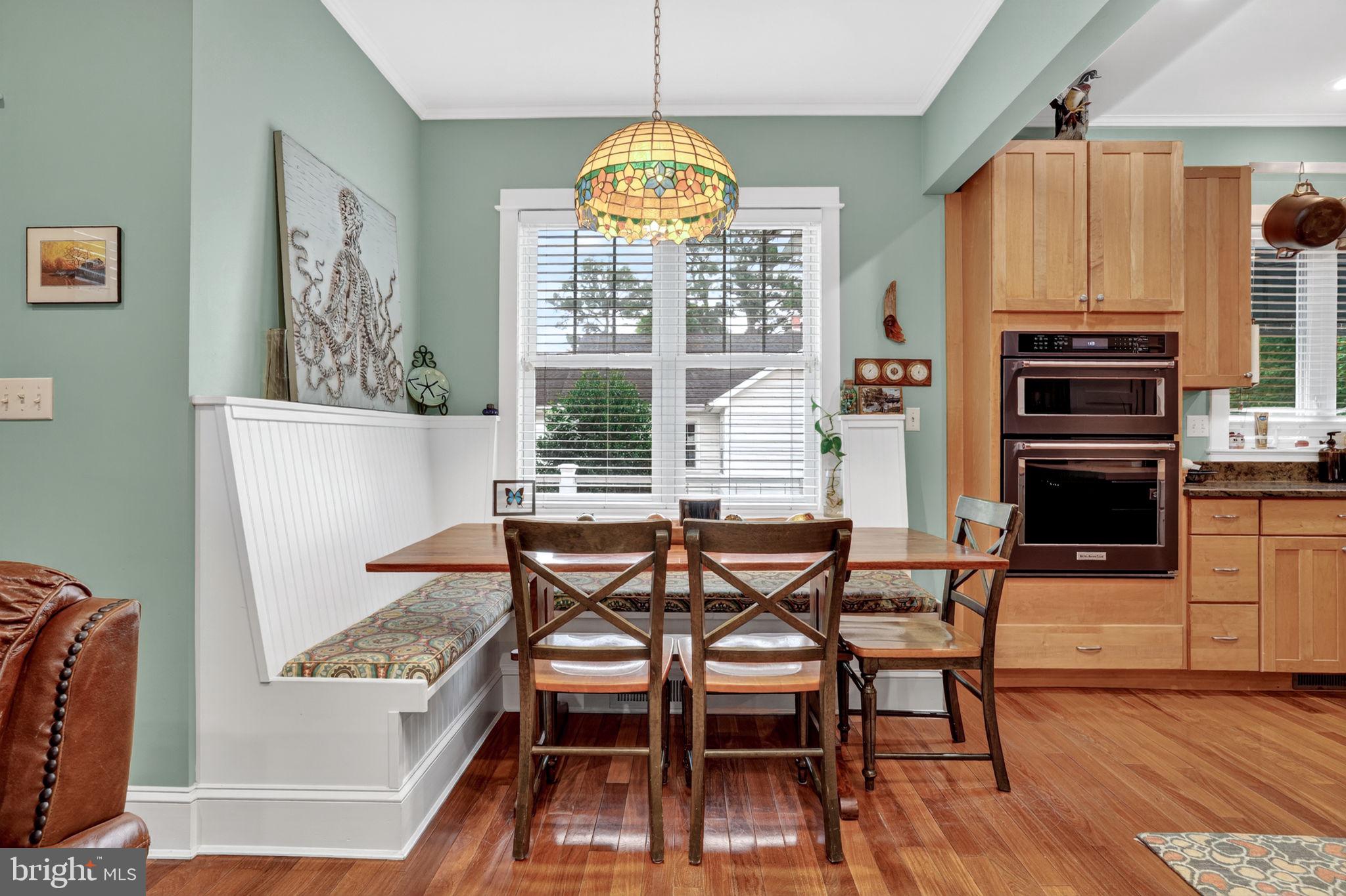 501 South Main Street Berlin, MD 21811 - Photo 23 of 75 a view of a dining room with furniture window and wooden floor