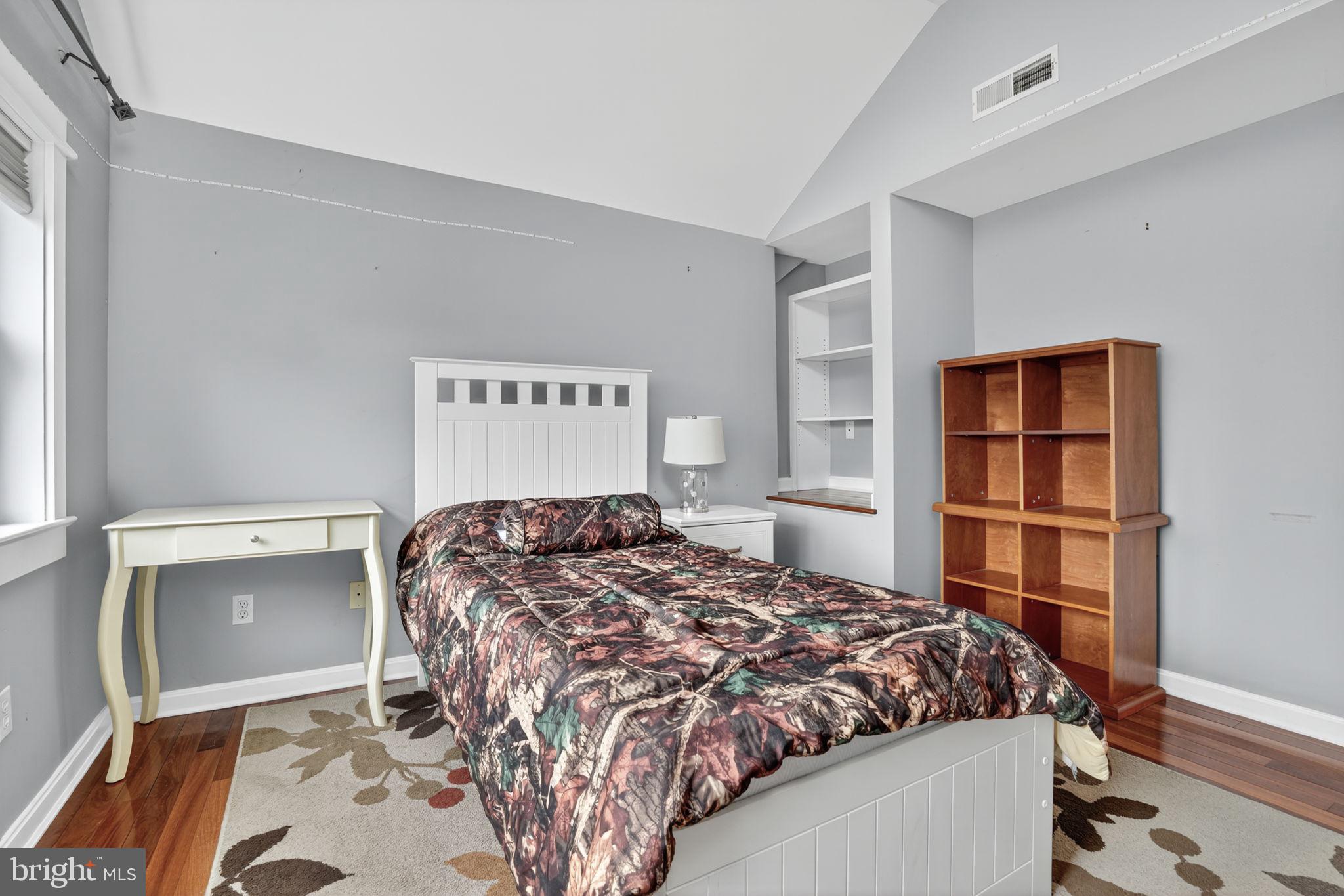 501 South Main Street Berlin, MD 21811 - Photo 29 of 75 a bedroom with a bed and a closet