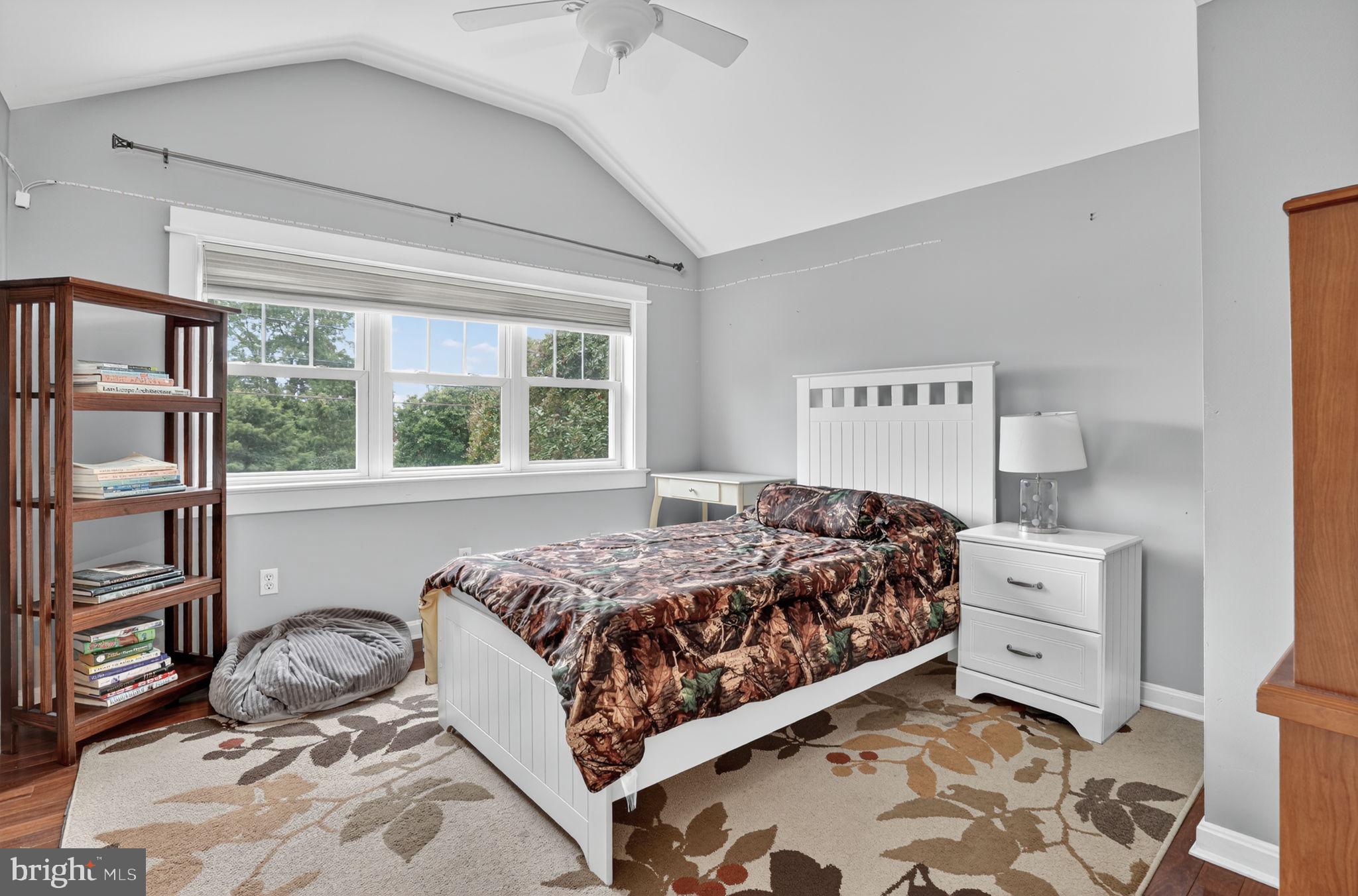 501 South Main Street Berlin, MD 21811 - Photo 30 of 75 a bedroom with a bed and a window