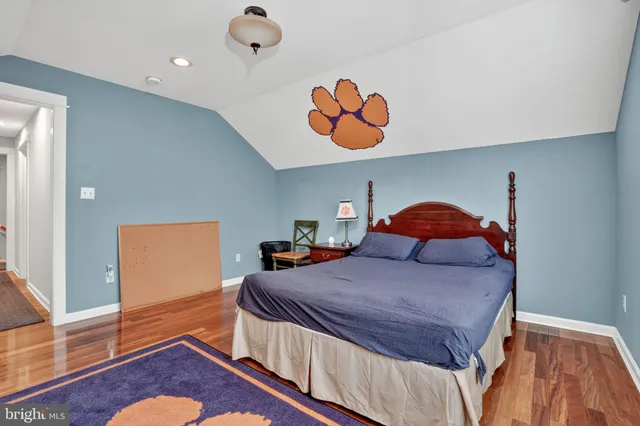 a bedroom with a bed and a dresser