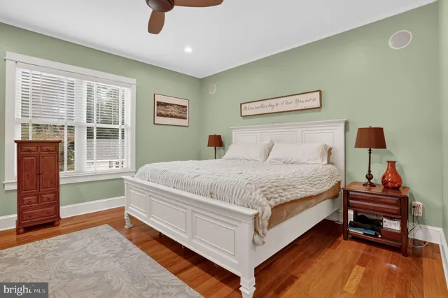 a living room with hard wood floors and a window