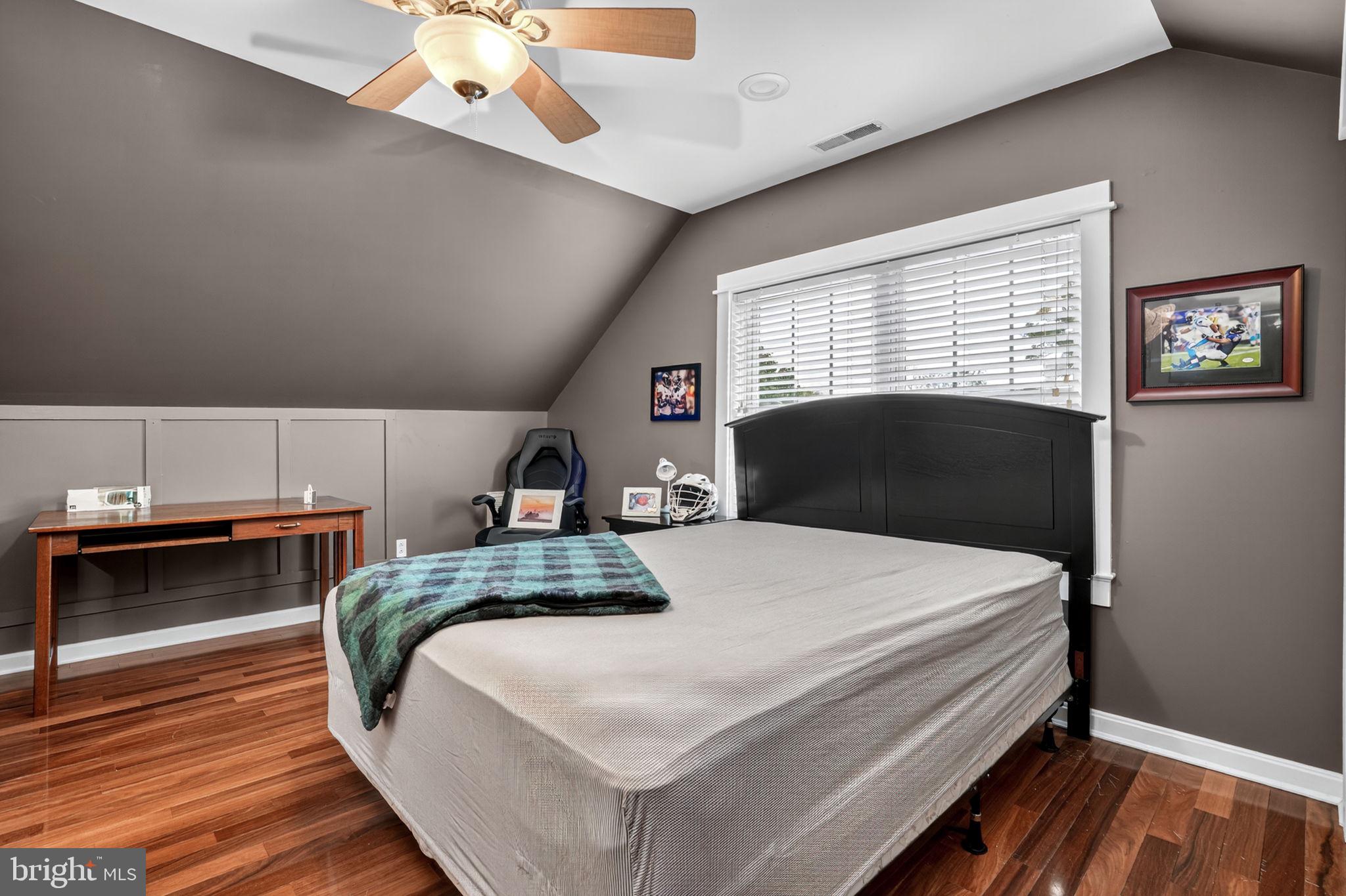 501 South Main Street Berlin, MD 21811 - Photo 43 of 75 a bedroom with a bed and a dresser