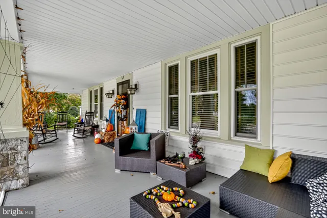 a living room with furniture fireplace and flat screen tv