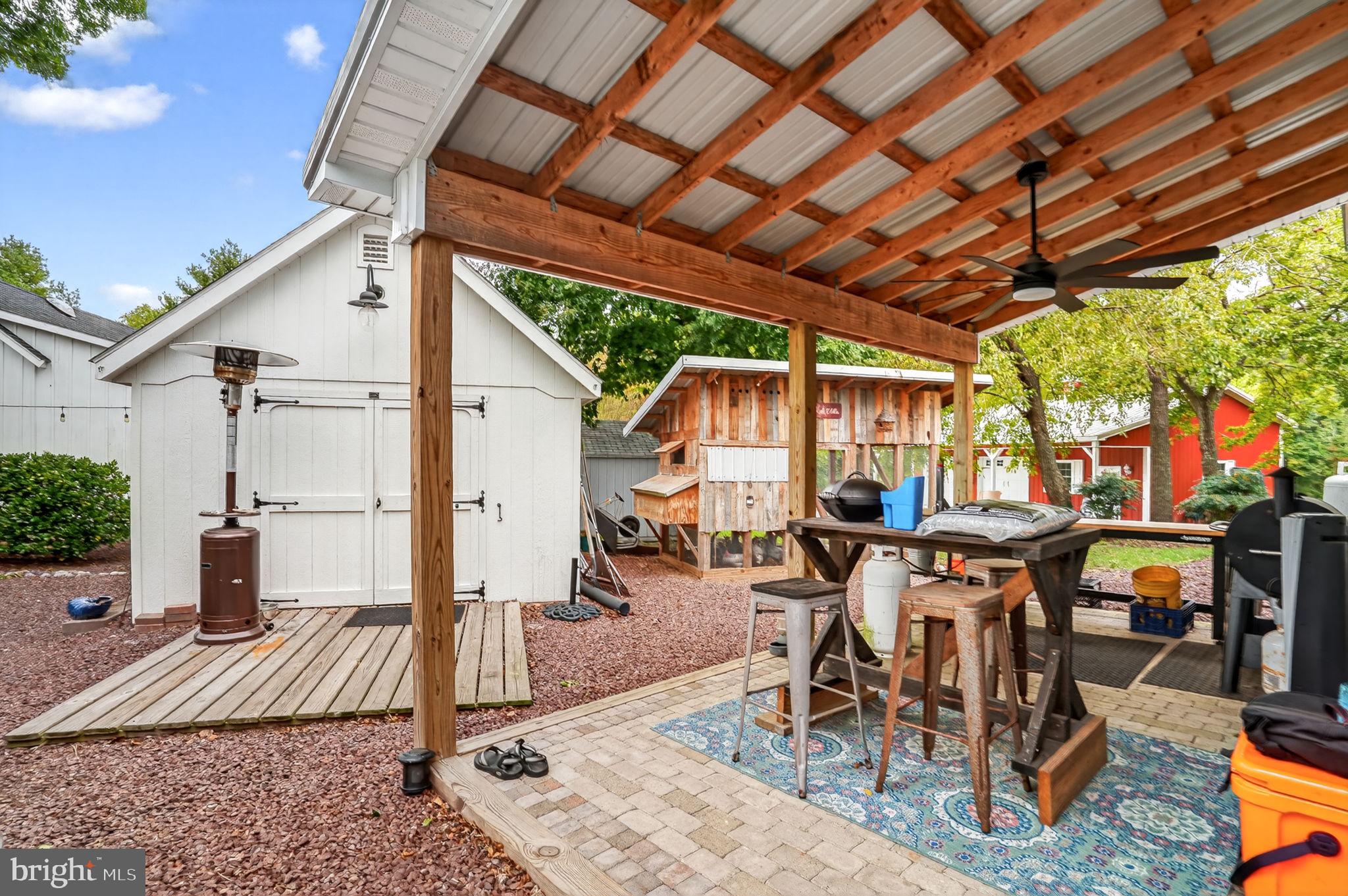 501 South Main Street Berlin, MD 21811 - Photo 62 of 75 a view of a patio with table and chairs and potted plants